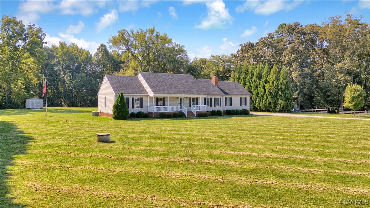 5285 Sandy Valley Road Mechanicsville, VA 23111 - Photo 2 of 37 a view of a swimming pool with a house in the background