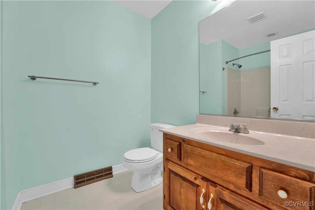 5285 Sandy Valley Road Mechanicsville, VA 23111 - Photo 30 of 37 a bathroom with a sink toilet and vanity