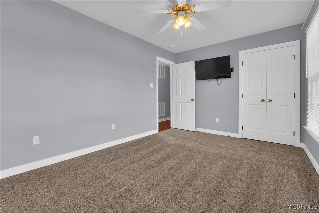 5285 Sandy Valley Road Mechanicsville, VA 23111 - Photo 32 of 37 a view of an empty room with a chandelier fan