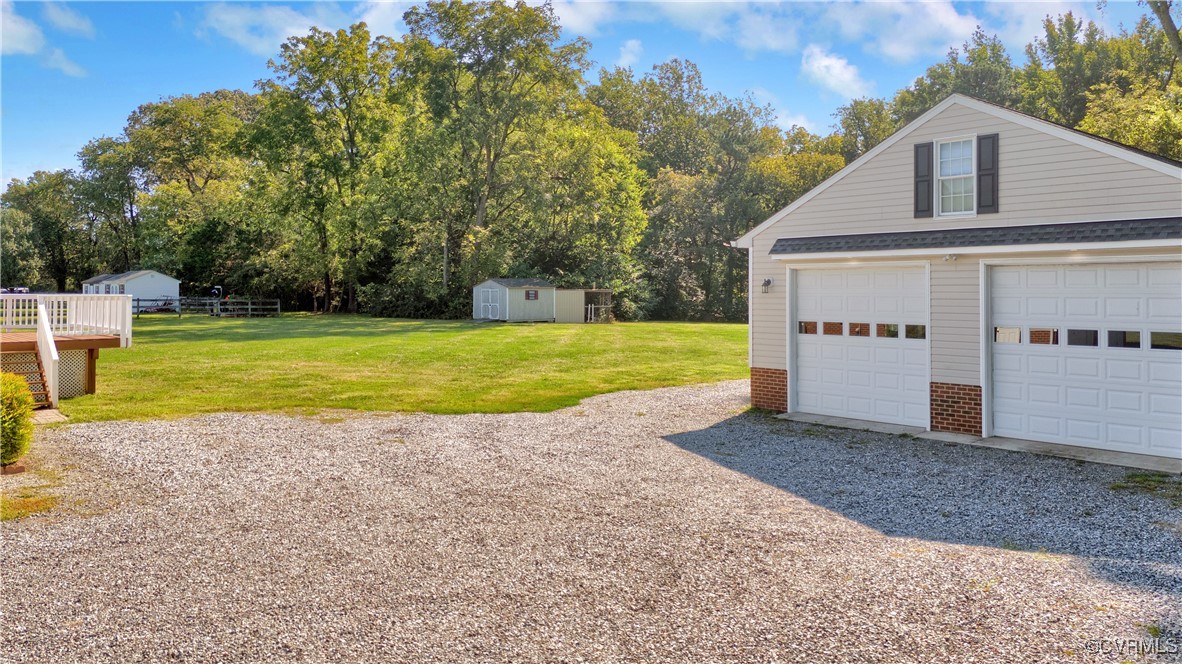 5285 Sandy Valley Road Mechanicsville, VA 23111 - Photo 7 of 37 a view of a house with backyard and trees