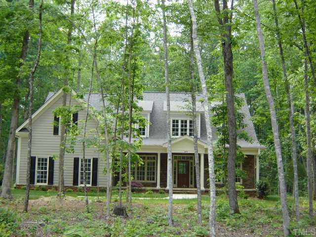 20 North Old Lantern Road Timberlake, NC 27583 - Photo 1 of 1 front view of a house with a garden