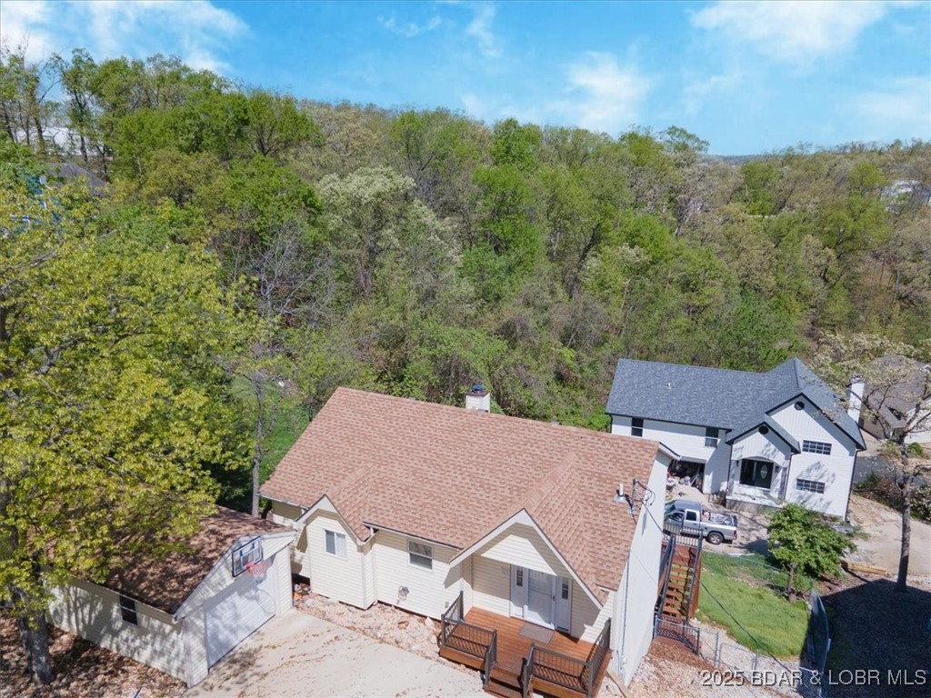 57 Oriole Road Lake Ozark, MO 65049 - Photo 2 of 41 Front of home with front deck.