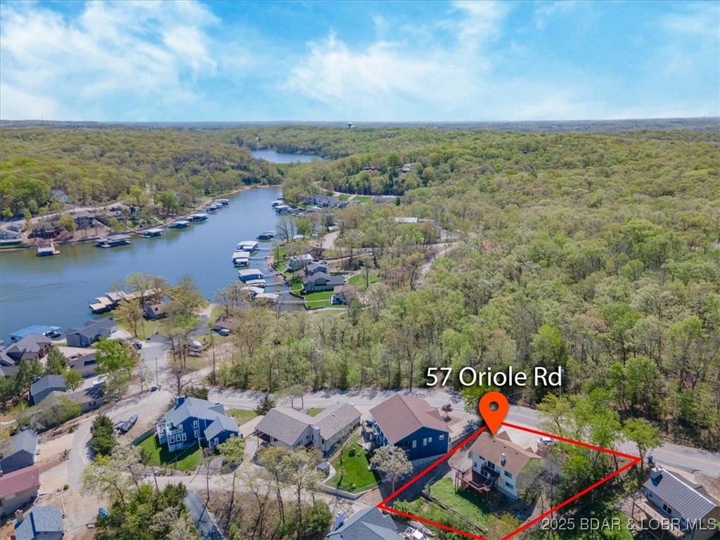 57 Oriole Road Lake Ozark, MO 65049 - Photo 5 of 41 Drone view from the rear of the home.