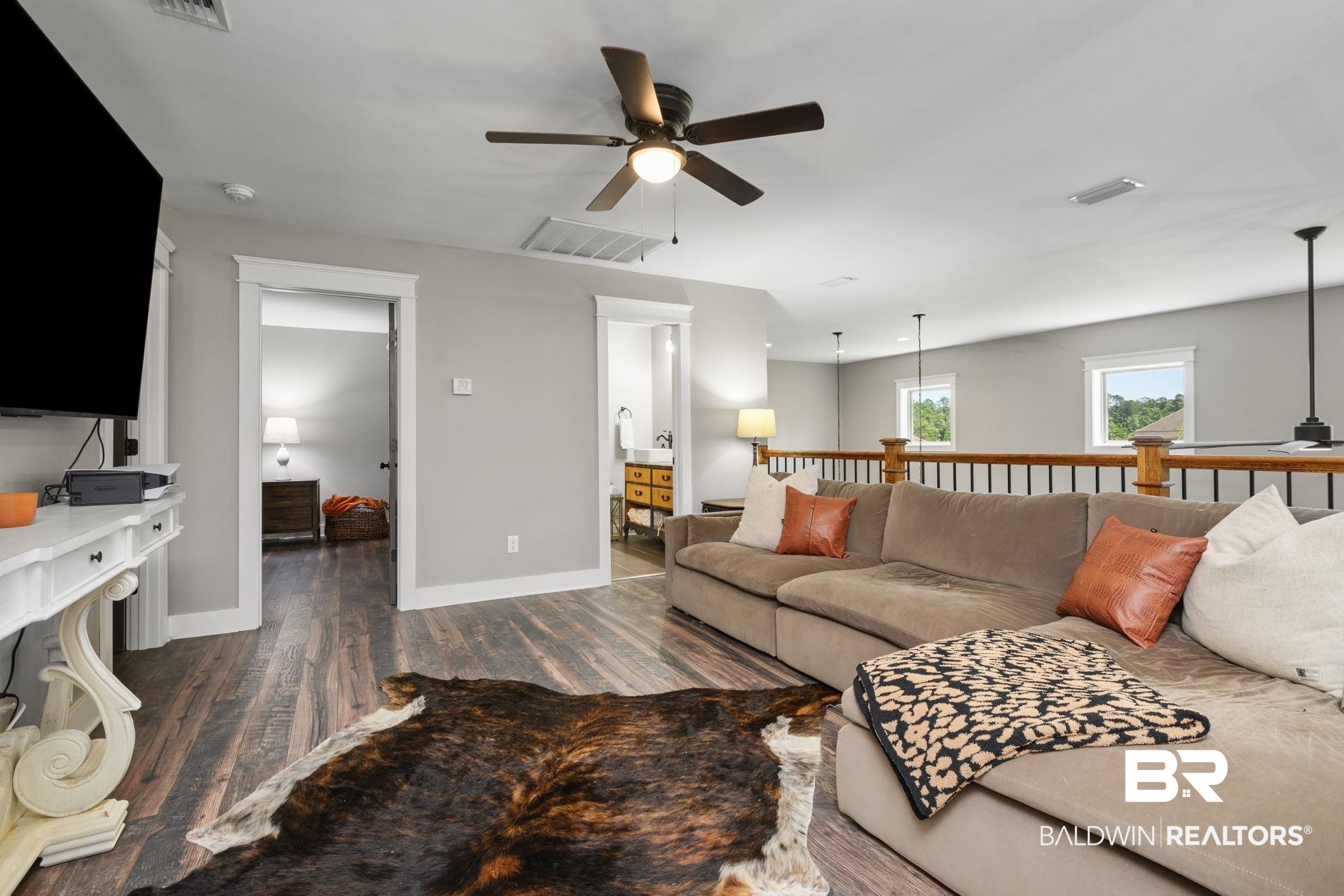 11025 Creax Road Axis, AL 36505 - Photo 29 of 45 Spacious loft area featuring wood-finish flooring, a ceiling fan with light fixture, and a light gray wall color