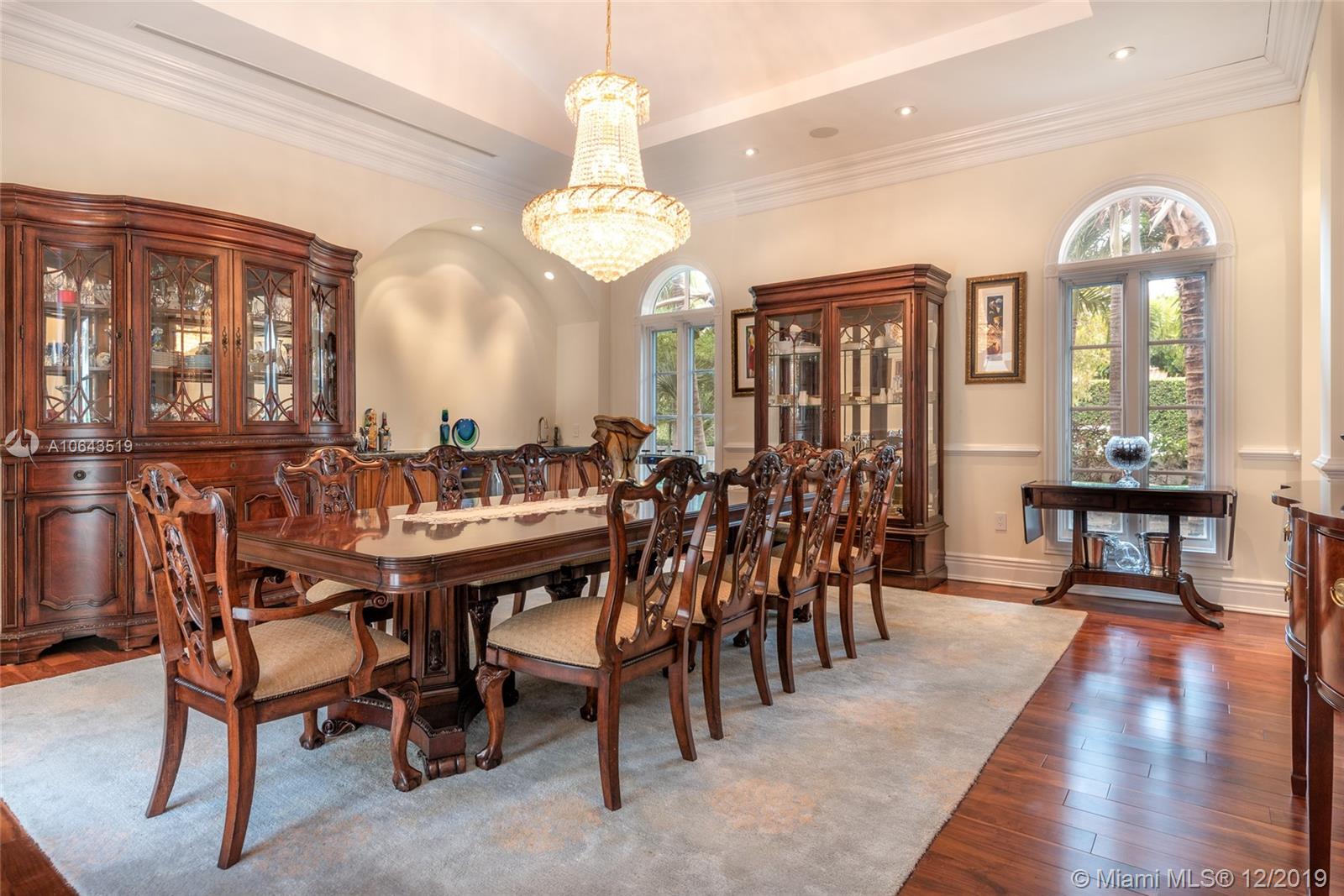 3400 Pine Tree Drive Miami Beach, FL 33140 - Photo 13 of 52 Formal Dining Room with Built In Wet Bar