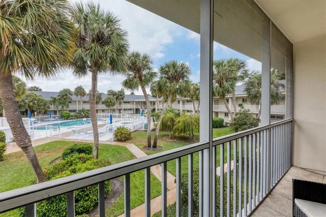 a view of swimming pool from a balcony