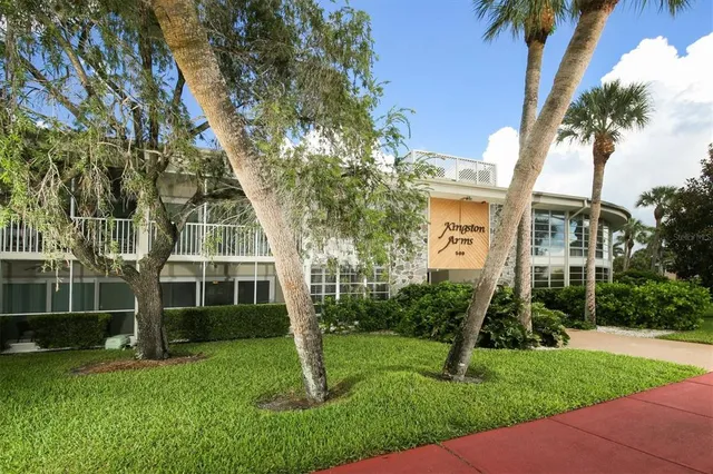 a view of house with a yard