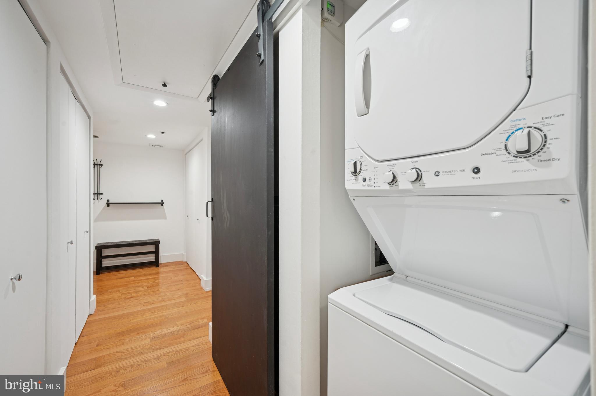 301 Race Street, Unit 308 Philadelphia, PA 19106 - Photo 15 of 17 a view of washer and dryer with bathroom in the background