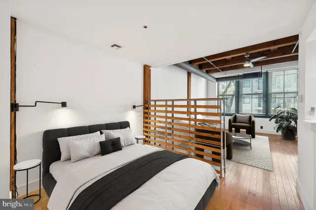 a bedroom with a bed and a walk in closet