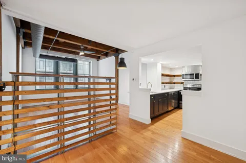 a view of kitchen with cabinets and wooden floor