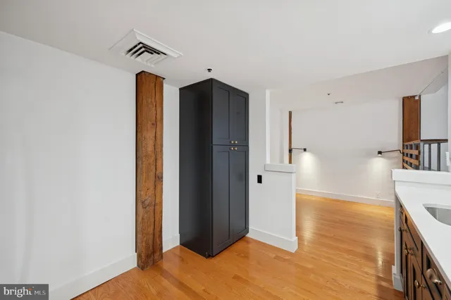 a view of a kitchen from the hallway