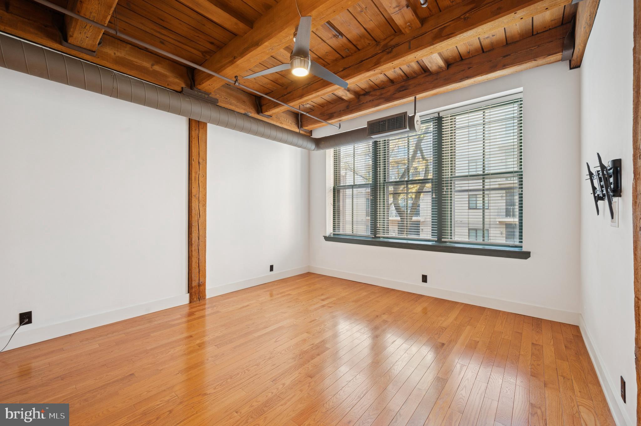 301 Race Street, Unit 308 Philadelphia, PA 19106 - Photo 9 of 17 a view of an empty room with wooden floor