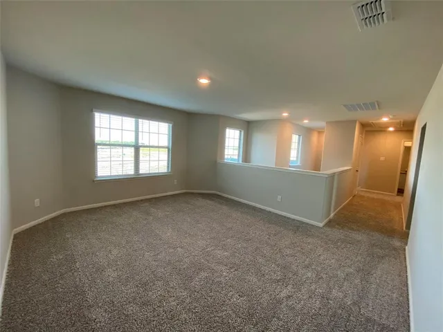 an empty room with a empty space and window