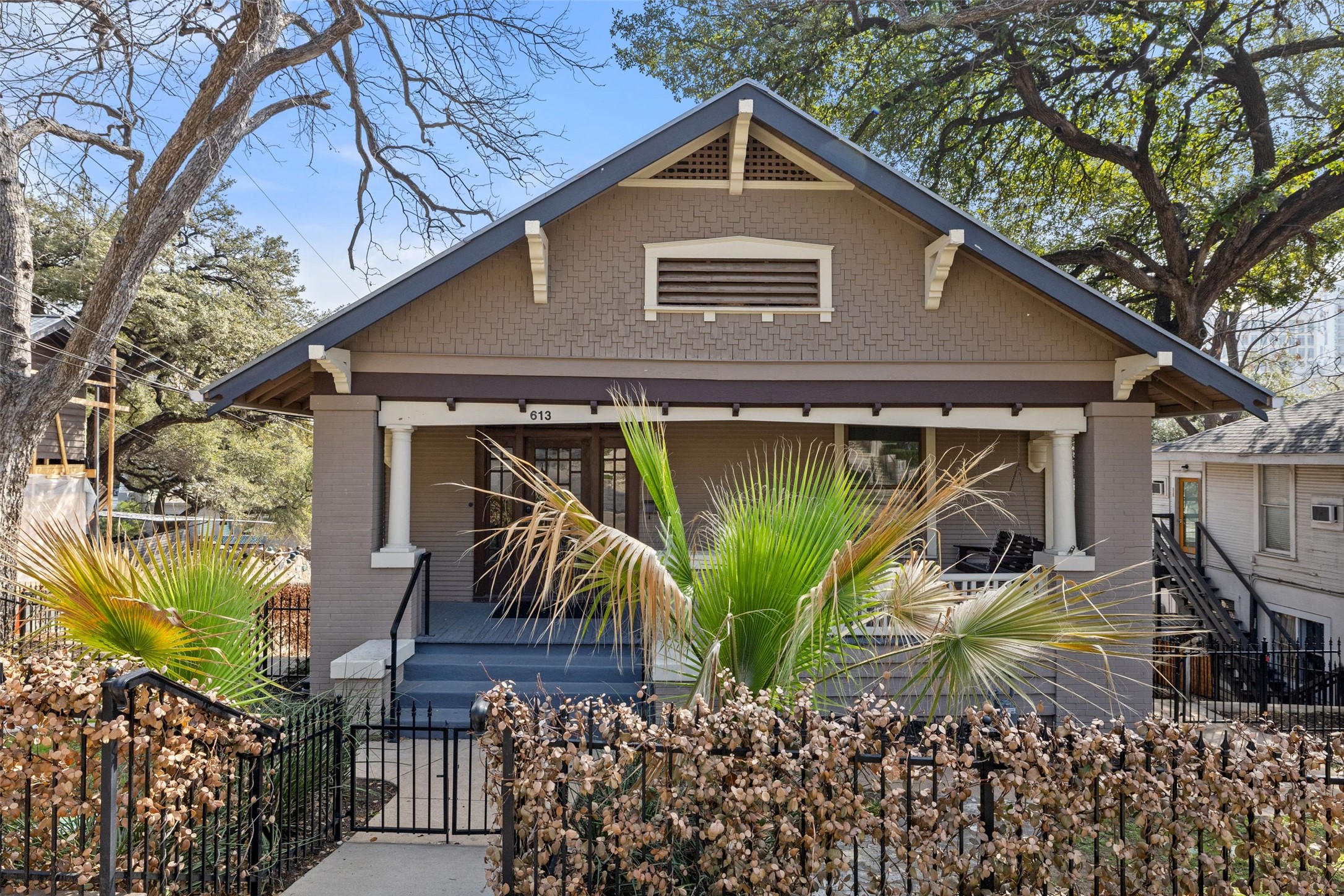 a front view of a house with garden
