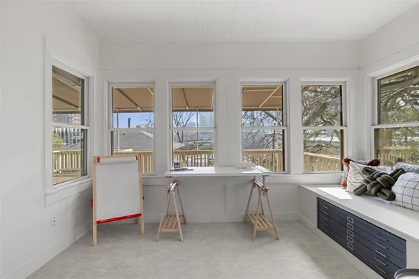 a living room with furniture and windows