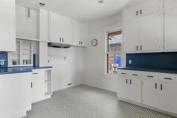 a view of cabinets and wooden floor