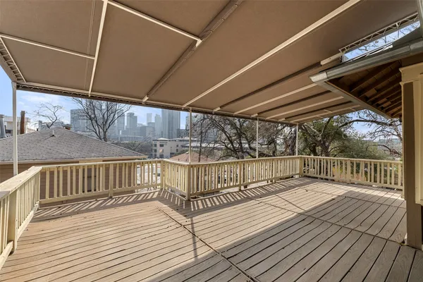 a view of balcony with wooden floor