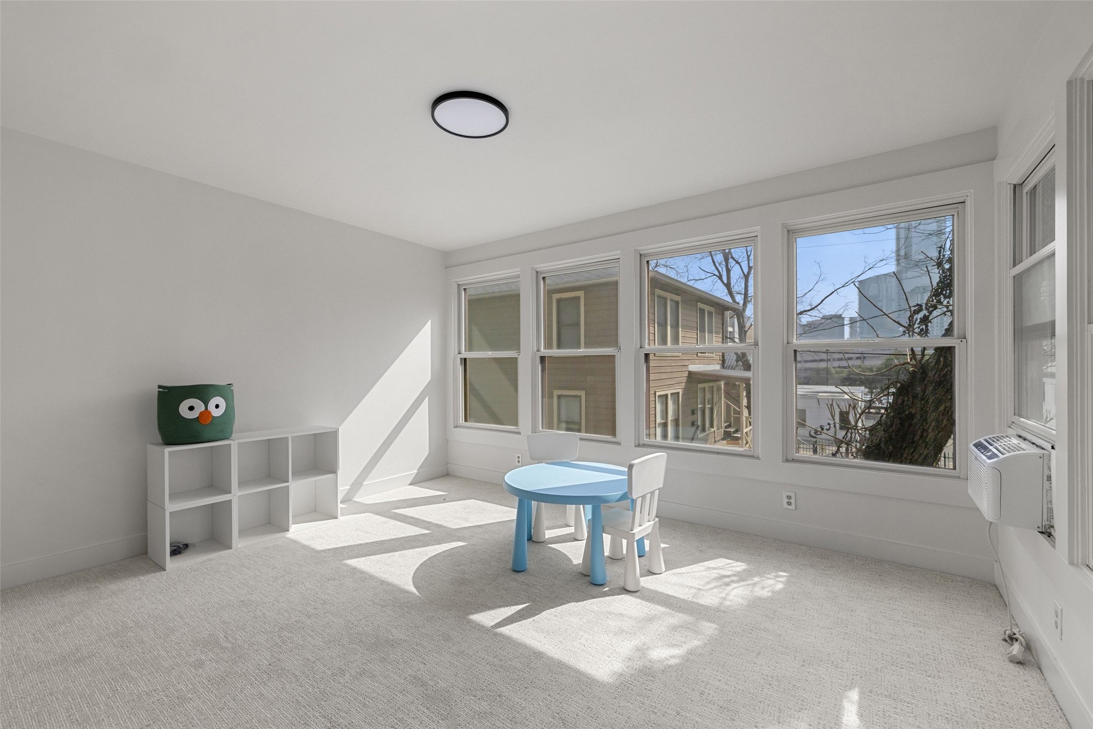 613 Baylor Street Austin, TX 78703 - Photo 22 of 40 a living room with furniture and a window