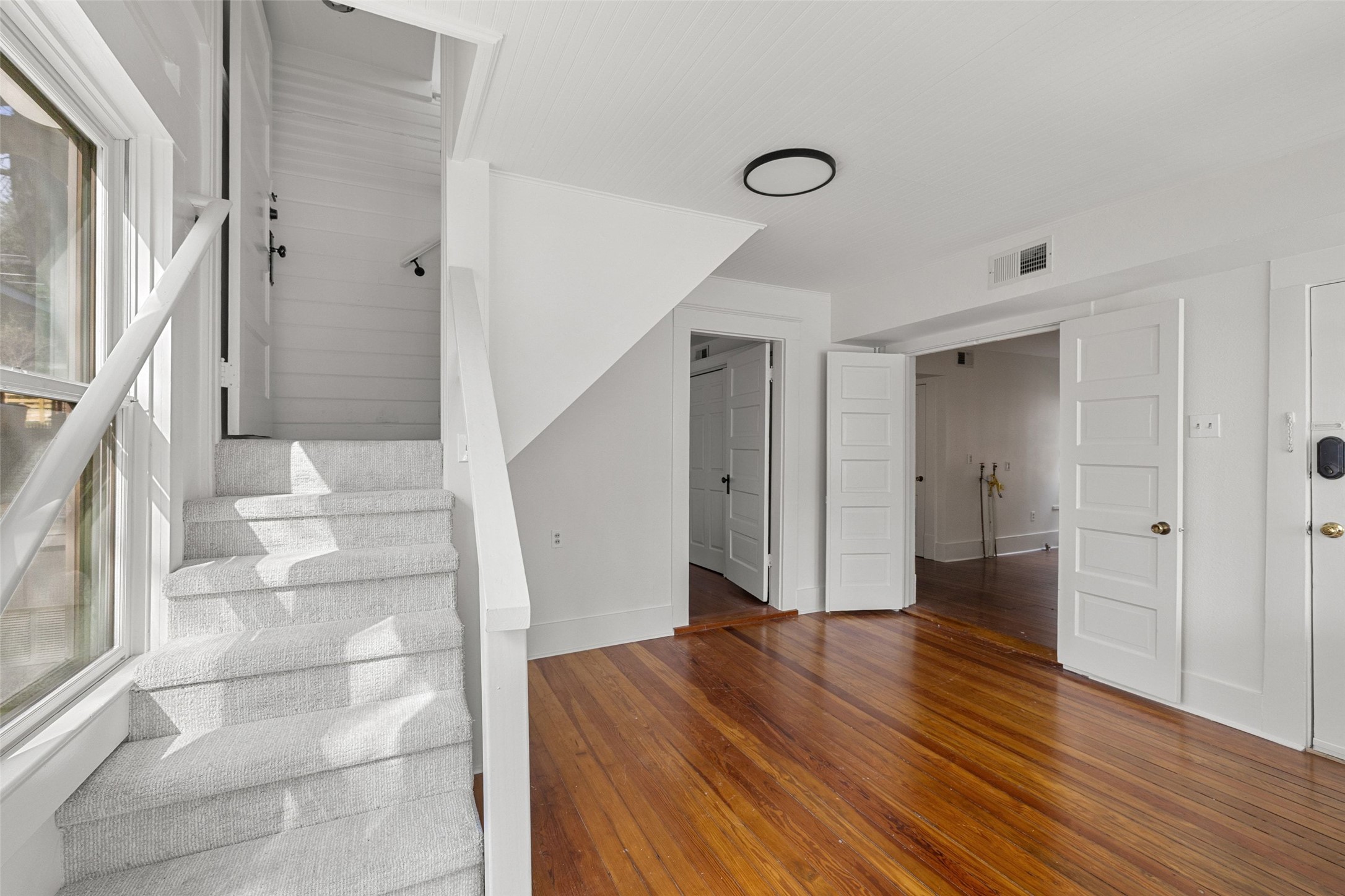613 Baylor Street Austin, TX 78703 - Photo 23 of 40 a view of entryway with wooden floor and staircase