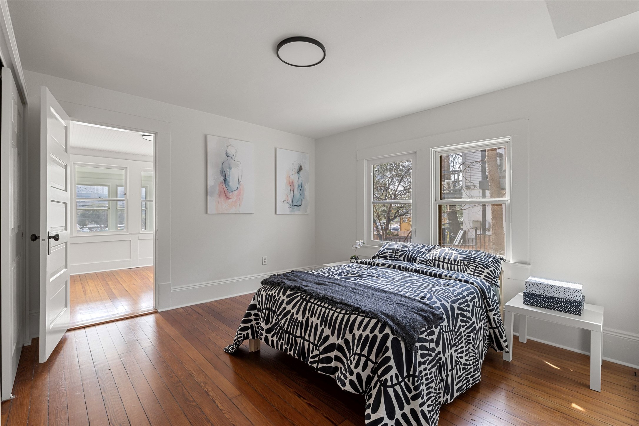 613 Baylor Street Austin, TX 78703 - Photo 26 of 40 a bed sitting in a spacious bedroom next to a window