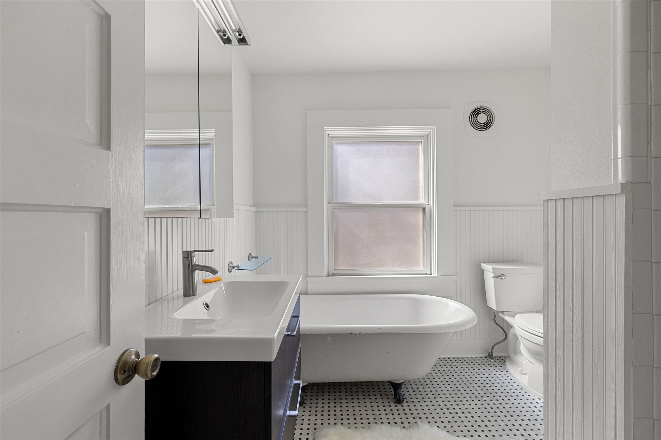 613 Baylor Street Austin, TX 78703 - Photo 27 of 40 a bathroom with a sink toilet and shower
