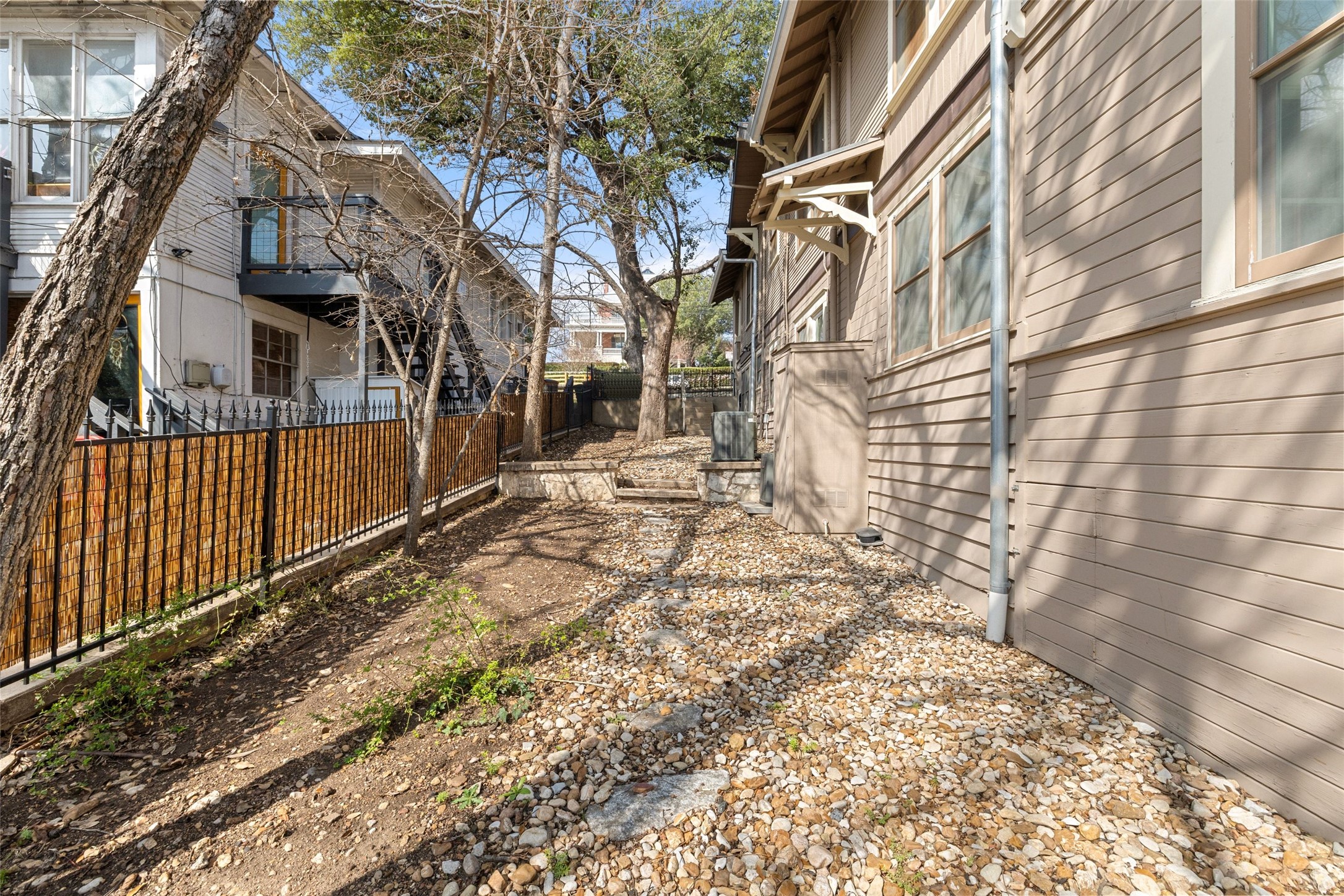 613 Baylor Street Austin, TX 78703 - Photo 30 of 40 a view of a house with a yard