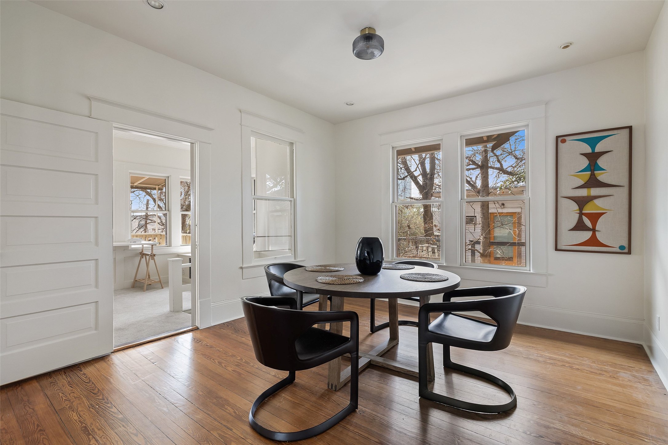 613 Baylor Street Austin, TX 78703 - Photo 7 of 40 a view of a dining room with furniture and wooden floor