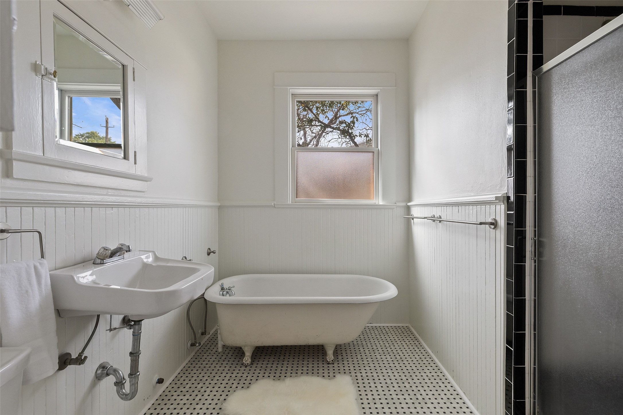 613 Baylor Street Austin, TX 78703 - Photo 8 of 40 a bathroom with a sink toilet and a mirror
