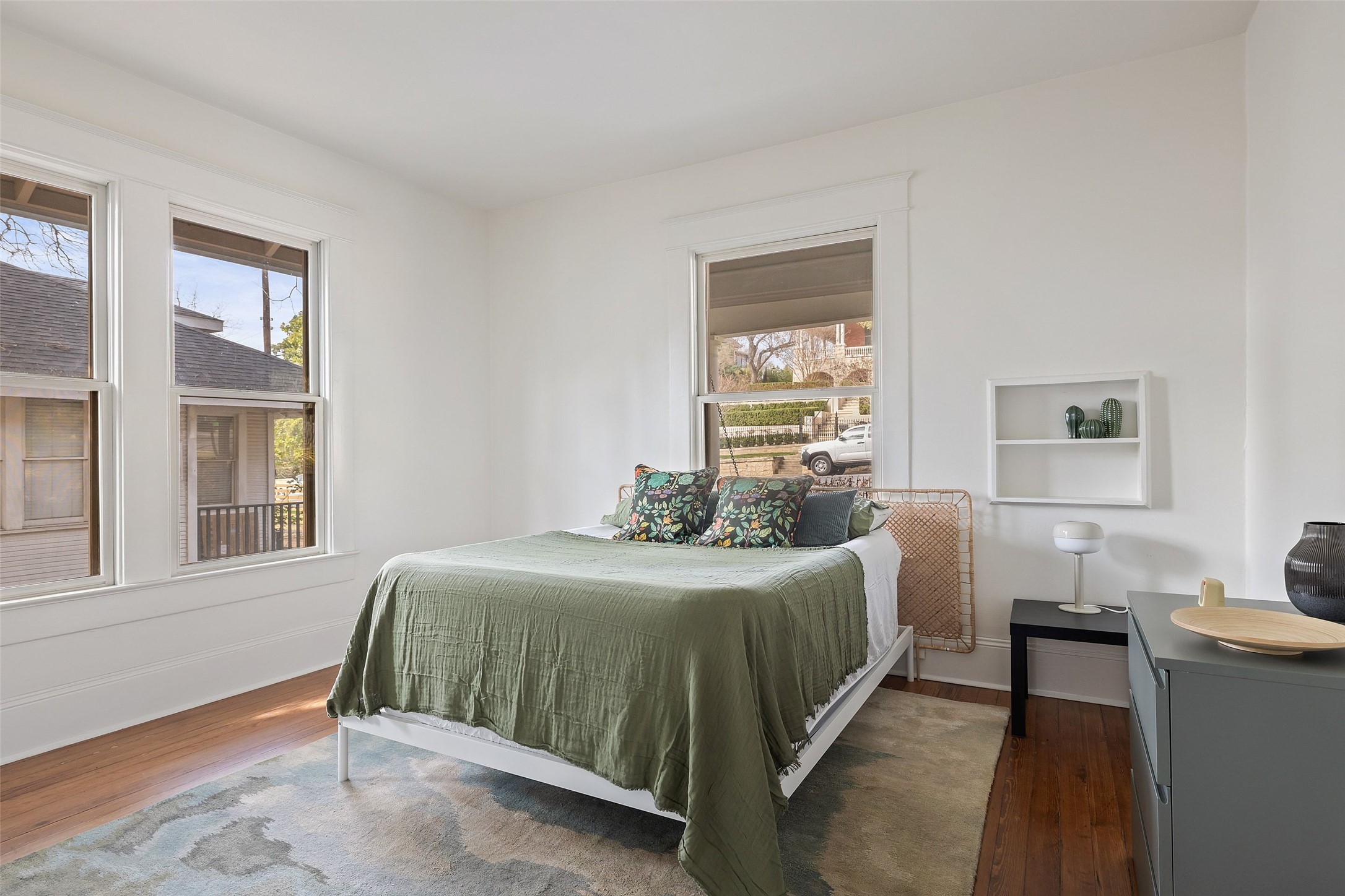 613 Baylor Street Austin, TX 78703 - Photo 10 of 40 a bedroom with a bed and a window