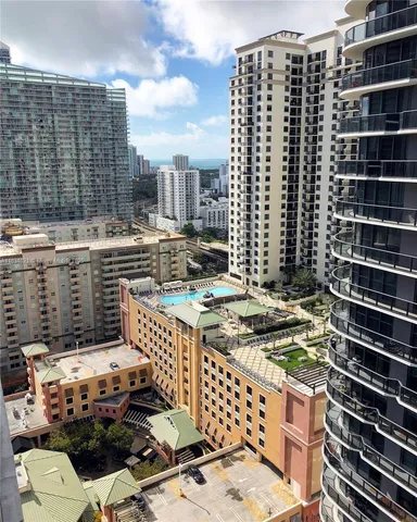 a view of a balcony with wooden floor