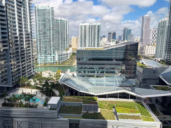 a view of swimming pool with outdoor seating and plants