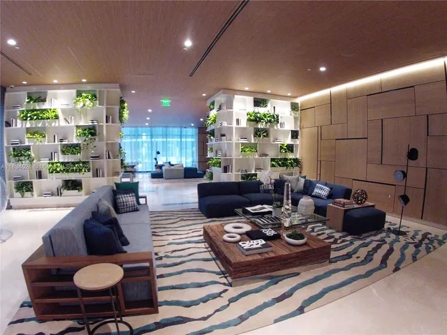 a living room with lots of furniture and a table