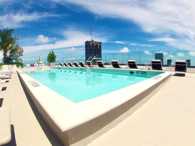 a view of swimming pool from a balcony