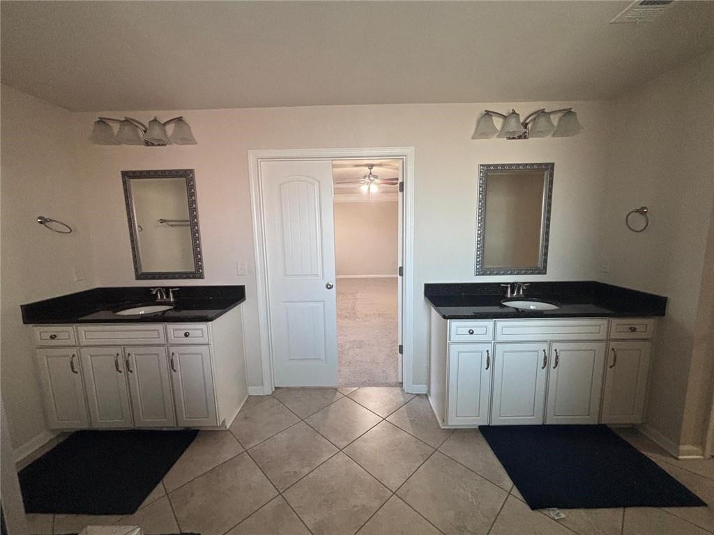 1615 Beckham Street Cumming, GA 30041 - Photo 17 of 33 a kitchen with a sink and a refrigerator