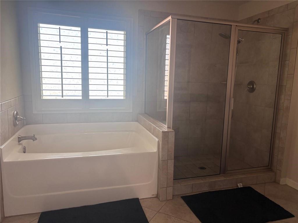 1615 Beckham Street Cumming, GA 30041 - Photo 18 of 33 a white bath tub sitting next to a window