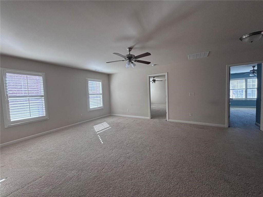 1615 Beckham Street Cumming, GA 30041 - Photo 31 of 33 a view of an empty room with a window