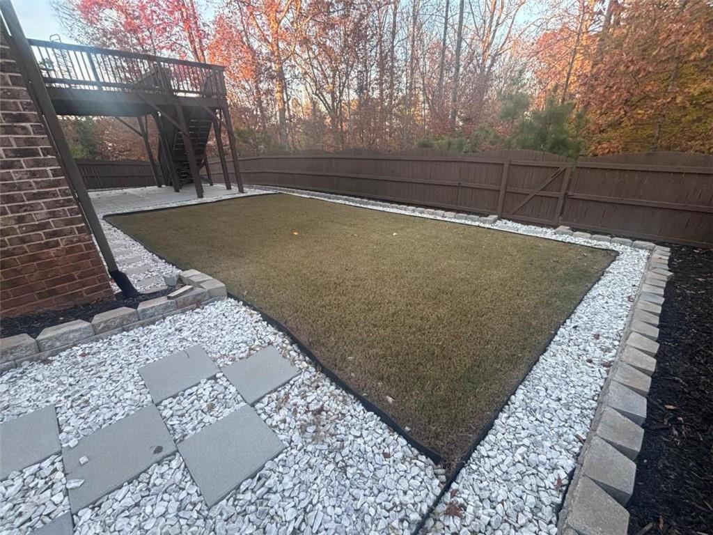 1615 Beckham Street Cumming, GA 30041 - Photo 5 of 33 a view of a backyard