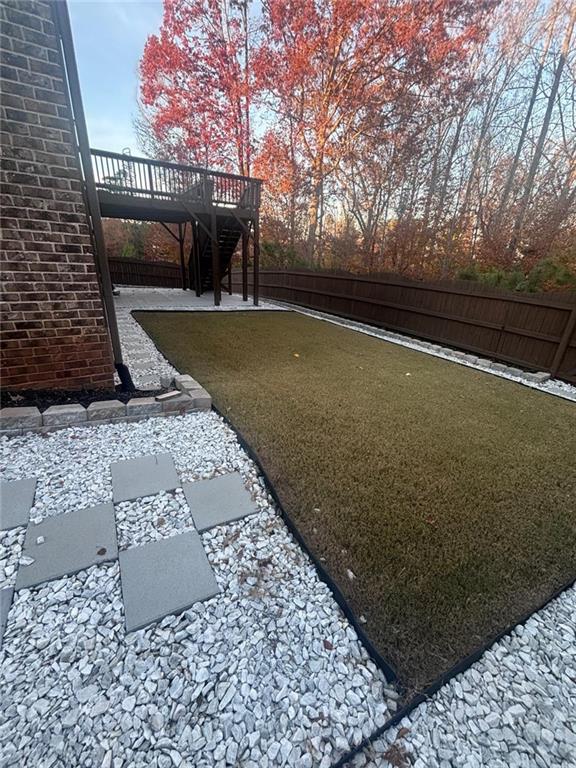 1615 Beckham Street Cumming, GA 30041 - Photo 6 of 33 a view of a backyard of the house