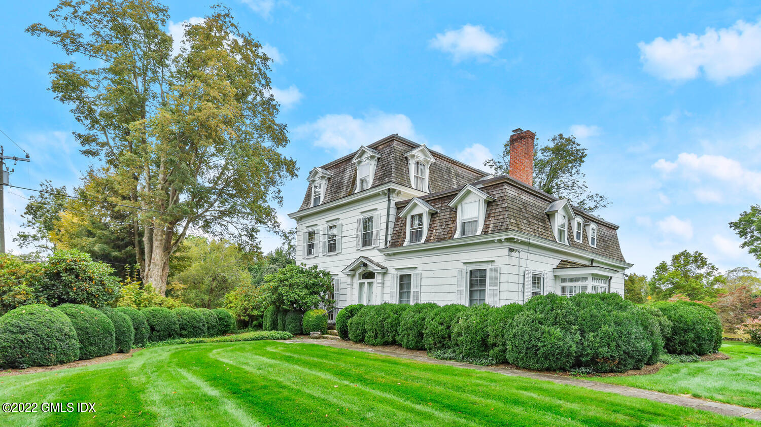 155 Taconic Road Greenwich, CT 06831 - Photo 1 of 26 a view of a big house with a big yard plants and large trees