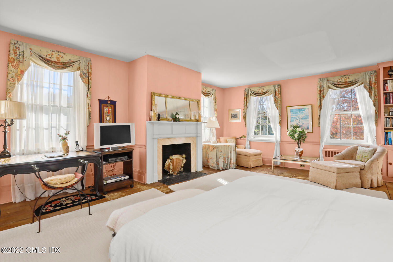 155 Taconic Road Greenwich, CT 06831 - Photo 23 of 26 a spacious bedroom with a bed and large windows
