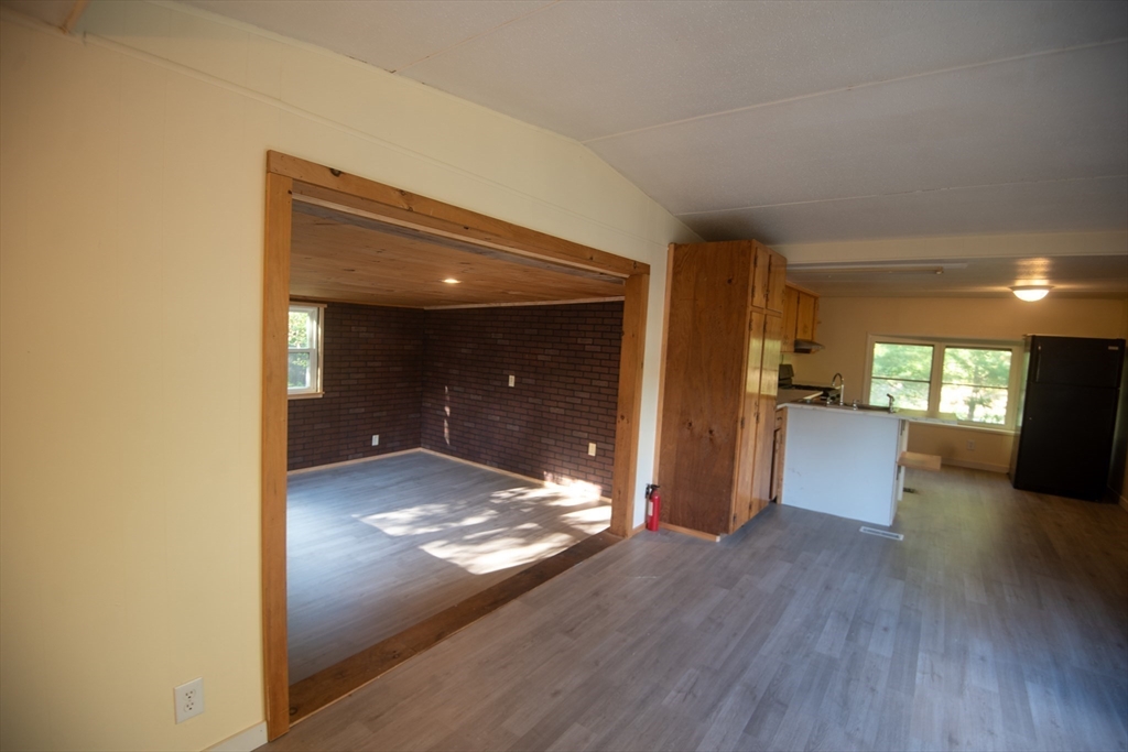 20 Dana Road Barre, MA 01005 - Photo 17 of 38 a view of a hallway with wooden floor and a living room