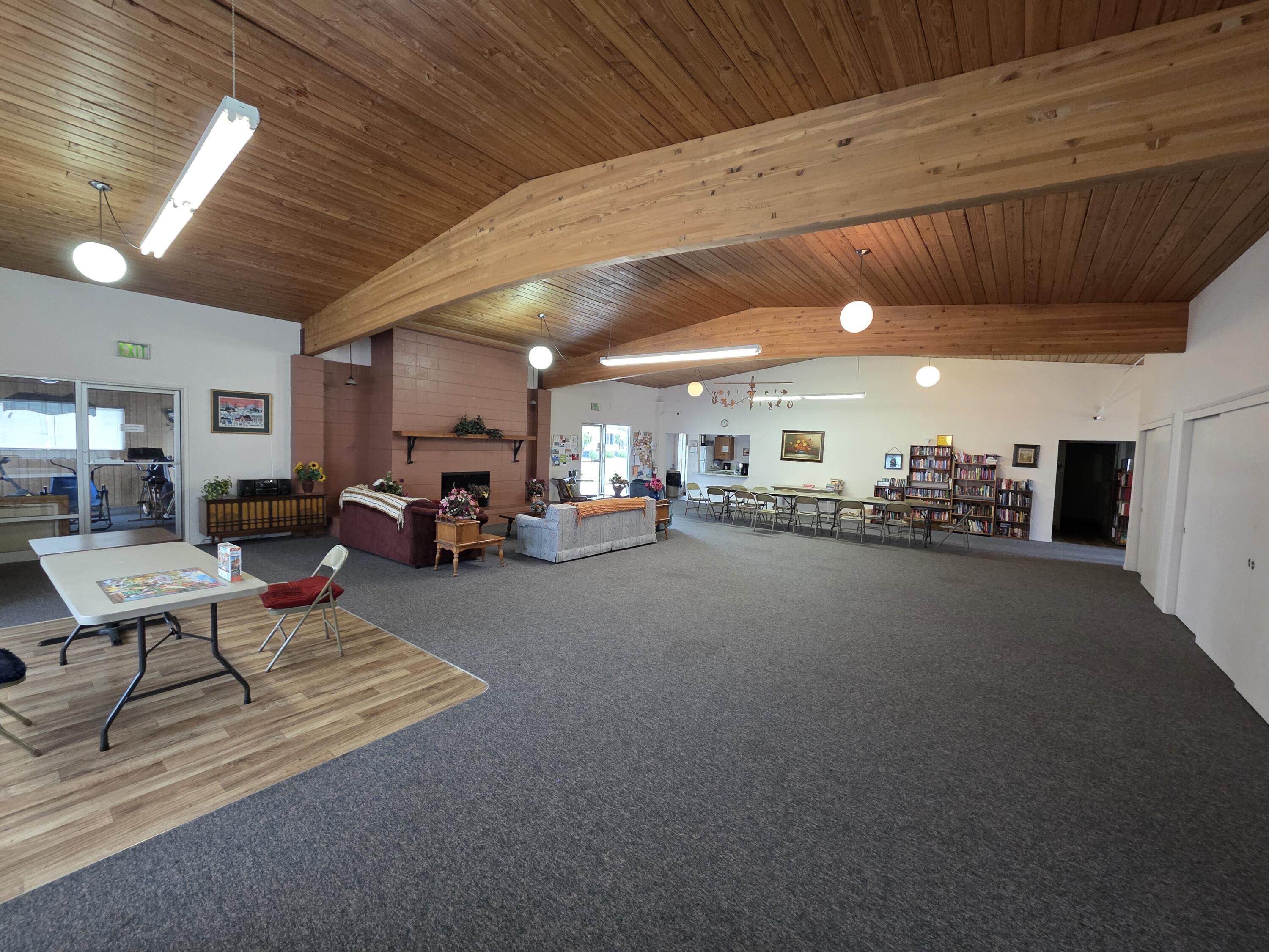 301 Freeman Road, Unit 30 Central Point, OR 97502 - Photo 23 of 26 a living room with lots of furniture and a chandelier