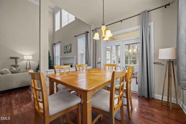 a dining room with furniture and wooden floor