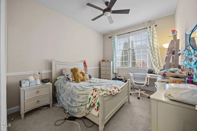 a bed room with a bed and a window