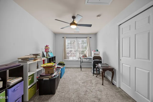 a workspace room with furniture cabinet and a window