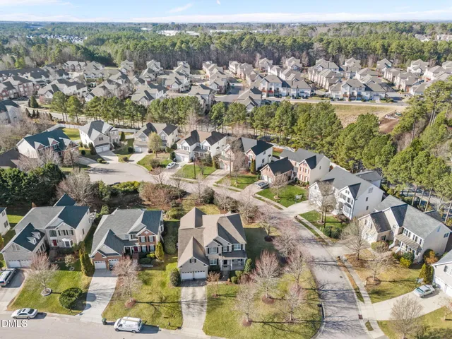an aerial view of residential houses with outdoor space