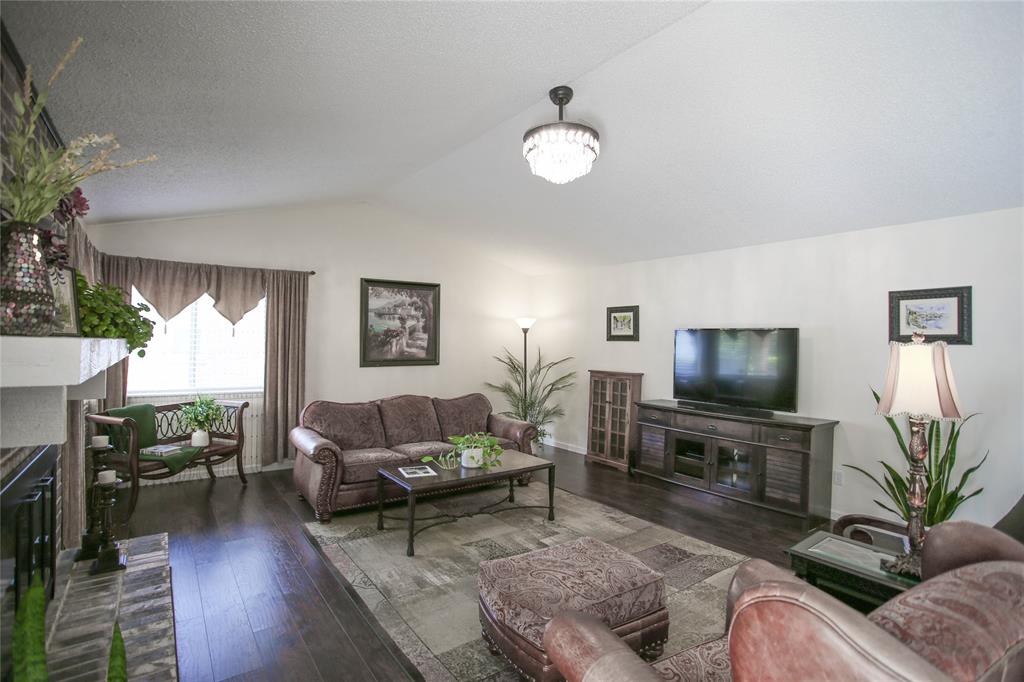 1720 Crystal Way Plano, TX 75074 - Photo 6 of 32 a living room with furniture and a flat screen tv