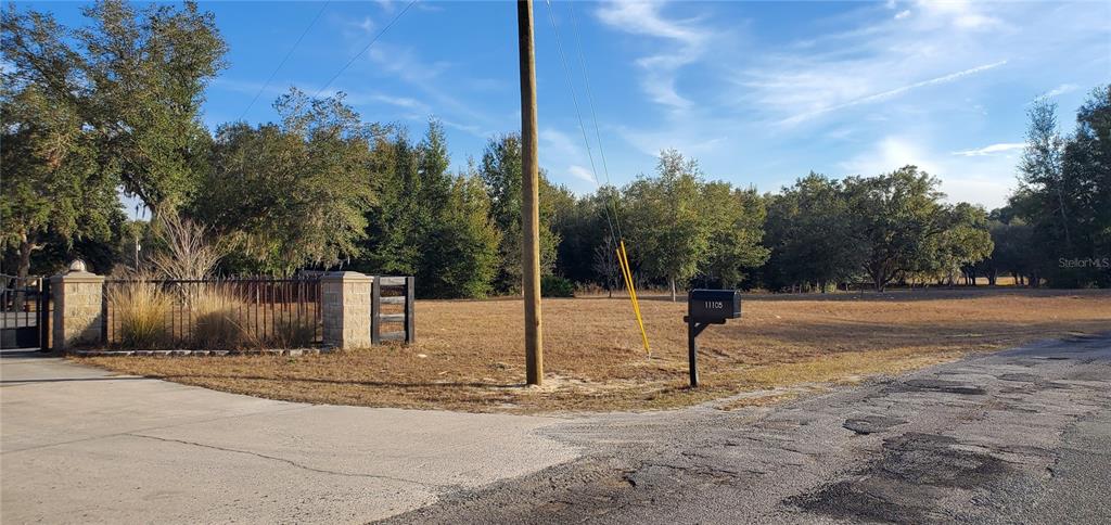 2 Rolling Hills Dunnellon, FL 34432 - Photo 6 of 7 a street sign on a sidewalk next to a road