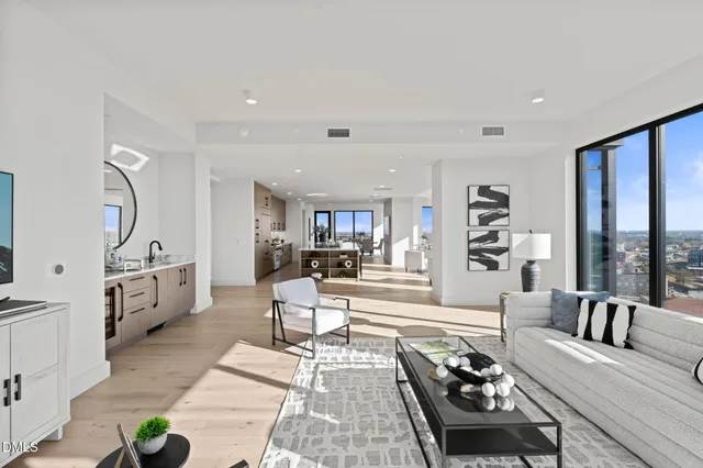 a view of a room that has a table and chairs in it