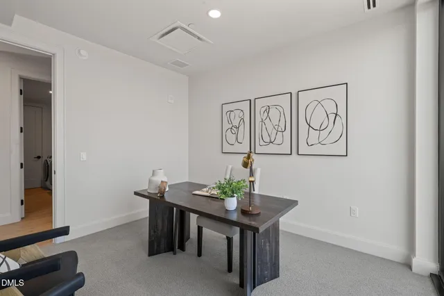 a view of a hallway with wooden floor and closet area